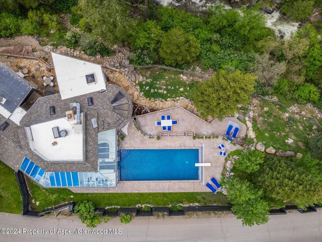 a view of a patio with swimming pool