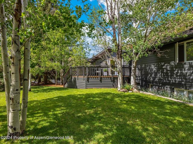 a living room with furniture fireplace and a flat screen tv