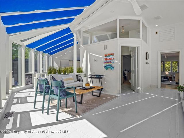 a view of a patio with swimming pool table and chairs