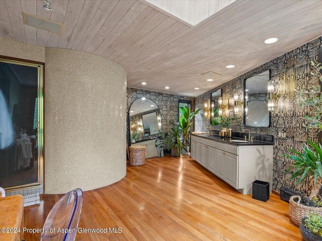 a room with wooden floor and furniture