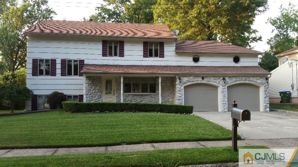 32 Peru Street Edison, NJ 08820 - Photo 1 of 25 a front view of a house with a garden