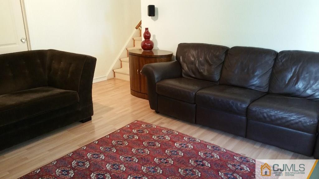 32 Peru Street Edison, NJ 08820 - Photo 13 of 25 a living room with a couch and a coffee table