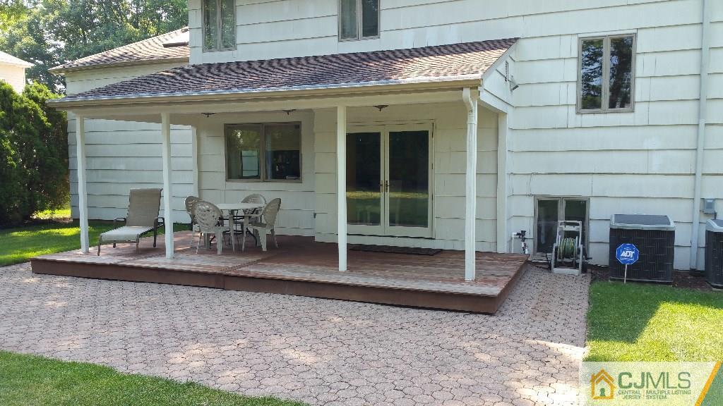 32 Peru Street Edison, NJ 08820 - Photo 23 of 25 a view of a house with a patio and a yard