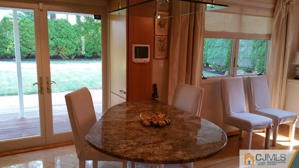 32 Peru Street Edison, NJ 08820 - Photo 5 of 25 a view of a dining room with furniture window and outside view