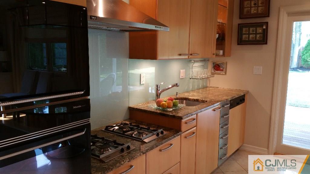 32 Peru Street Edison, NJ 08820 - Photo 6 of 25 a stove top oven sitting inside of a kitchen