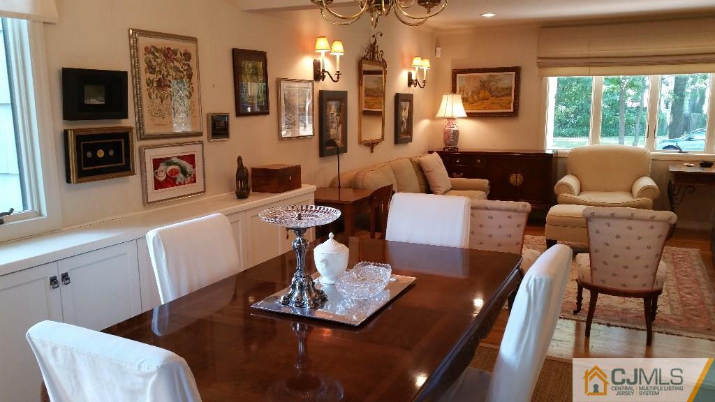 32 Peru Street Edison, NJ 08820 - Photo 7 of 25 a living room with furniture a flat screen tv and a large window