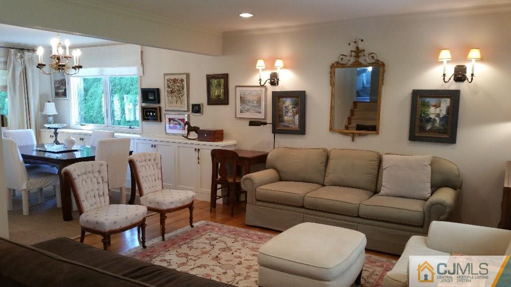 32 Peru Street Edison, NJ 08820 - Photo 10 of 25 a living room with furniture and a chandelier