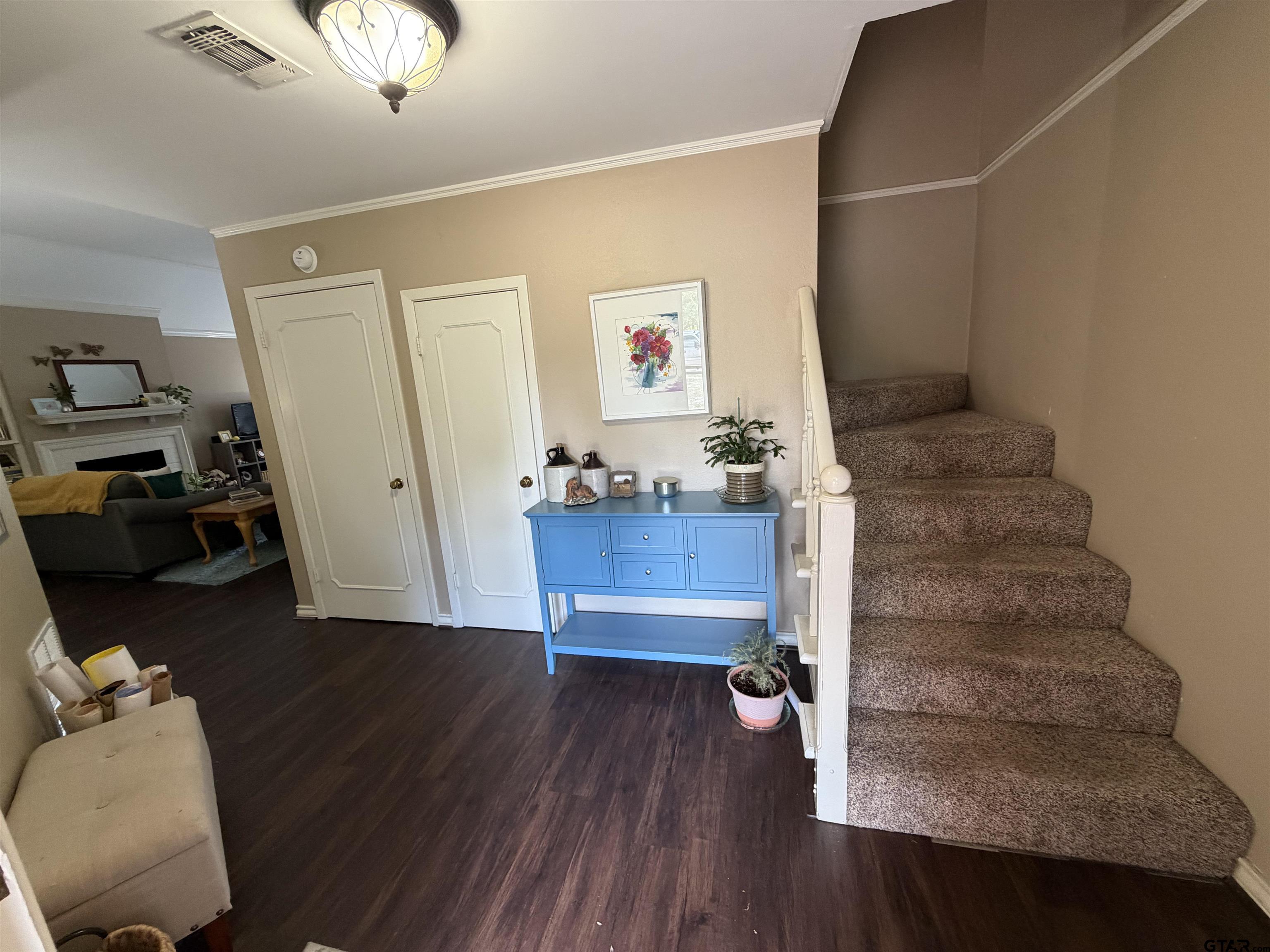 5704 Foxcroft Road Tyler, TX 75703 - Photo 2 of 10 a view of a hallway with wooden floor and workspace