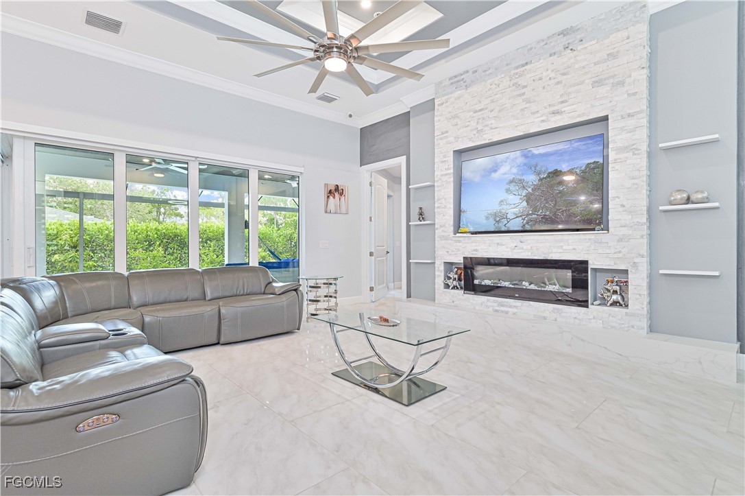 2273 Crystal Drive Fort Myers, FL 33907 - Photo 12 of 46 a living room with furniture and a fireplace