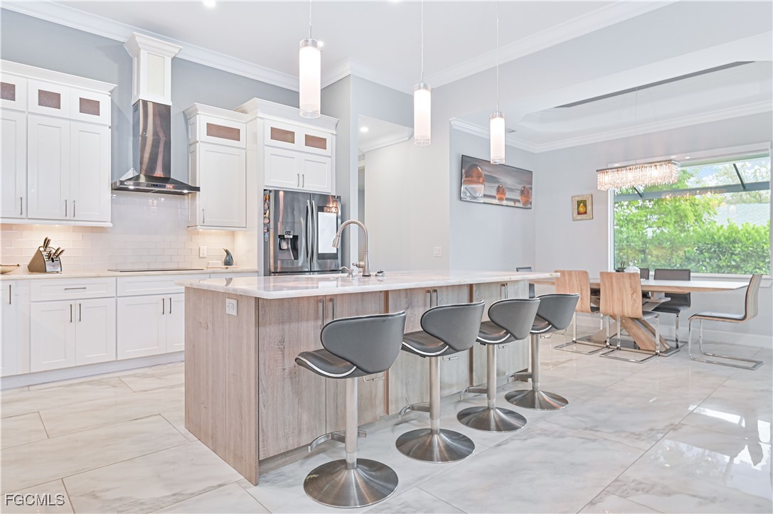 2273 Crystal Drive Fort Myers, FL 33907 - Photo 17 of 46 a kitchen with stainless steel appliances granite countertop a sink and a refrigerator