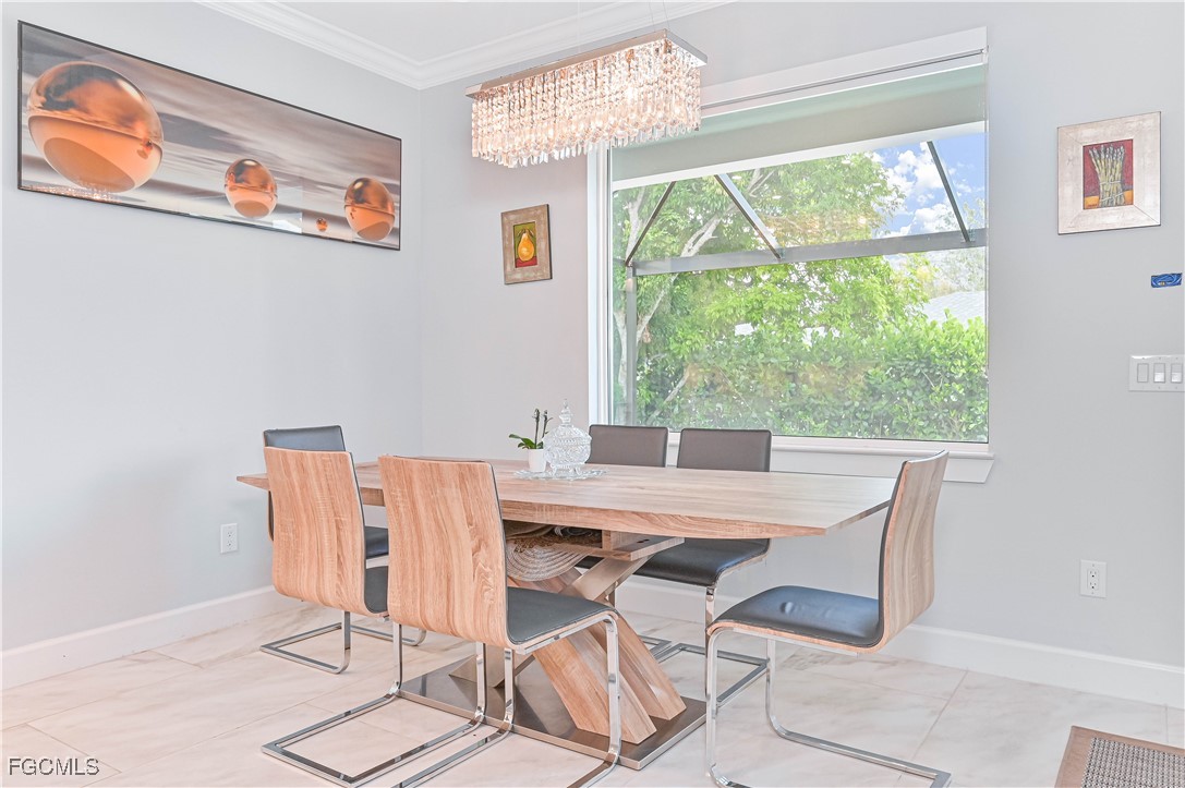 2273 Crystal Drive Fort Myers, FL 33907 - Photo 21 of 46 a view of a dining room with furniture a rug and wooden floor