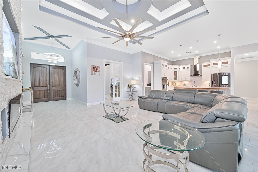 2273 Crystal Drive Fort Myers, FL 33907 - Photo 22 of 46 a living room with furniture and a chandelier