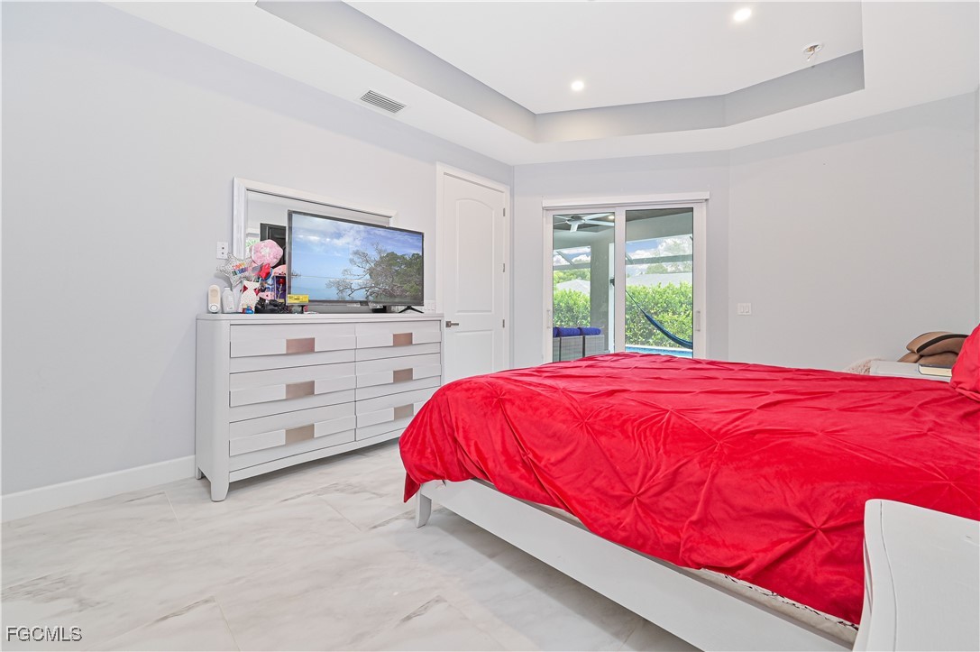 2273 Crystal Drive Fort Myers, FL 33907 - Photo 24 of 46 a bedroom with a bed and a dresser