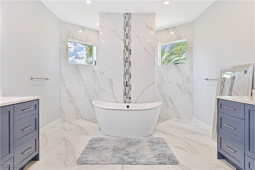 2273 Crystal Drive Fort Myers, FL 33907 - Photo 25 of 46 a bathroom with a sink a toilet and shower