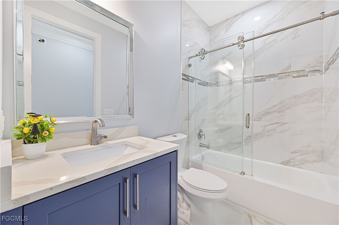 2273 Crystal Drive Fort Myers, FL 33907 - Photo 31 of 46 a bathroom with a sink a toilet and shower