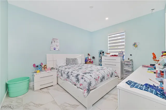 a utility room with sink dryer and washer