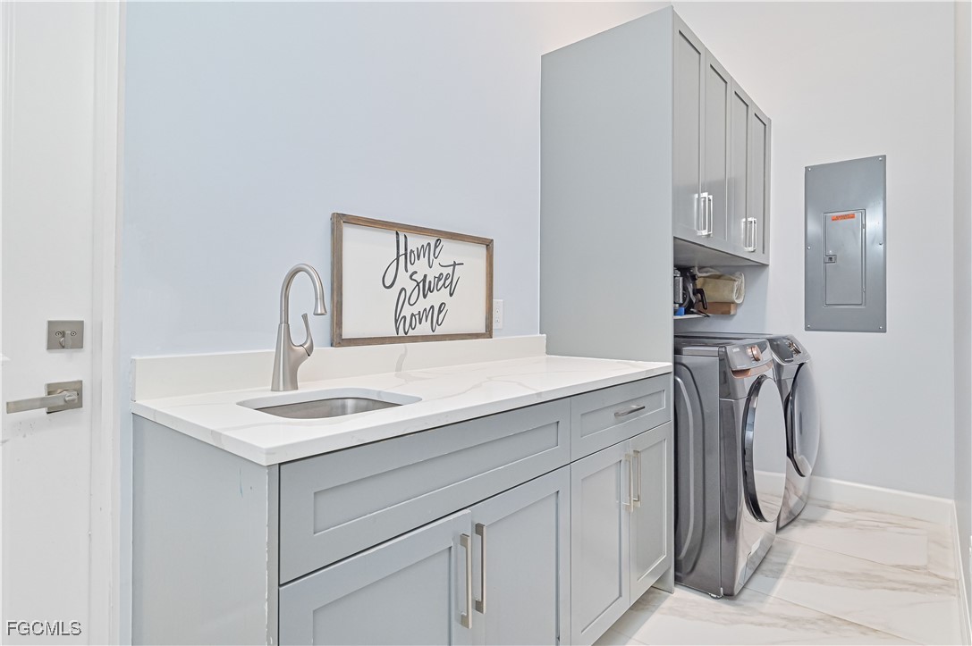 2273 Crystal Drive Fort Myers, FL 33907 - Photo 36 of 46 a utility room with sink dryer and washer