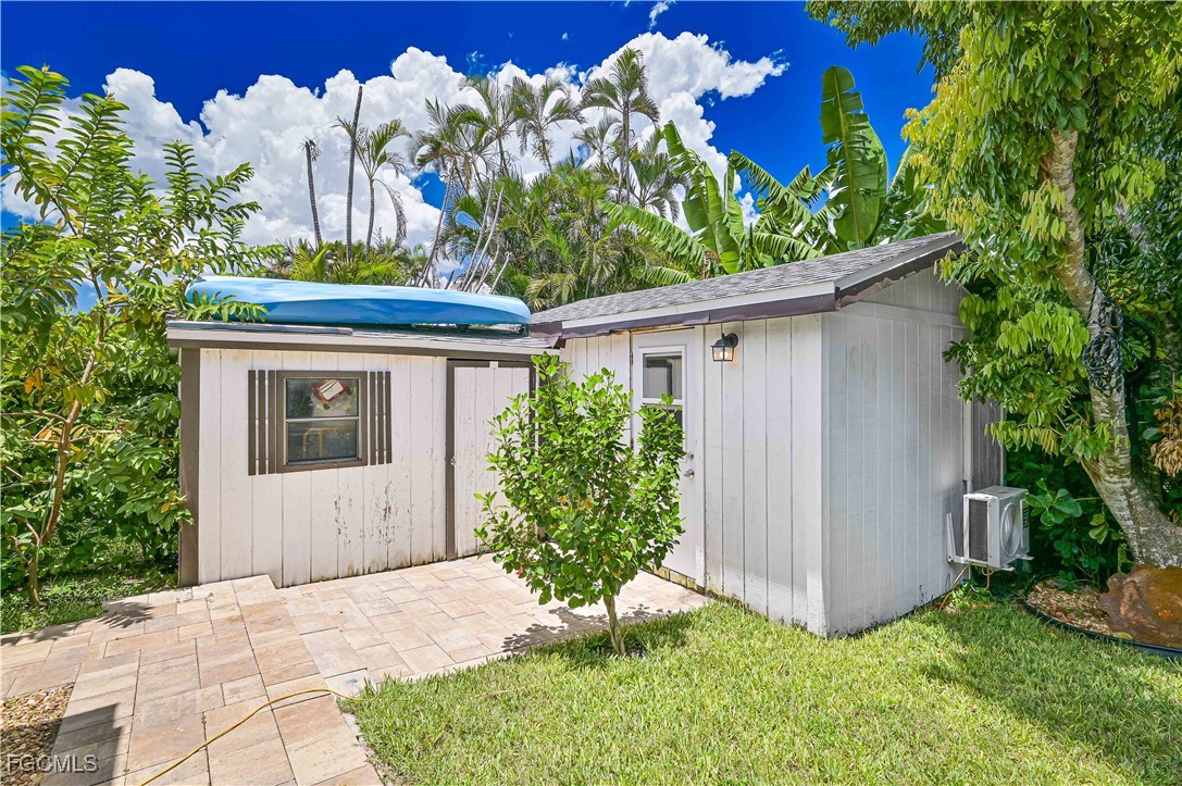 2273 Crystal Drive Fort Myers, FL 33907 - Photo 40 of 46 a front view of a house with garden