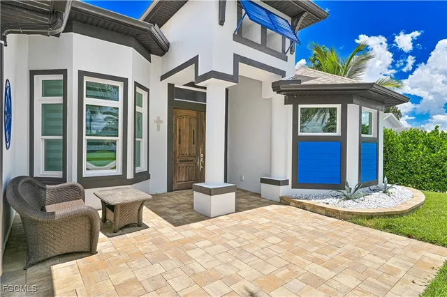 a front view of house with outdoor seating