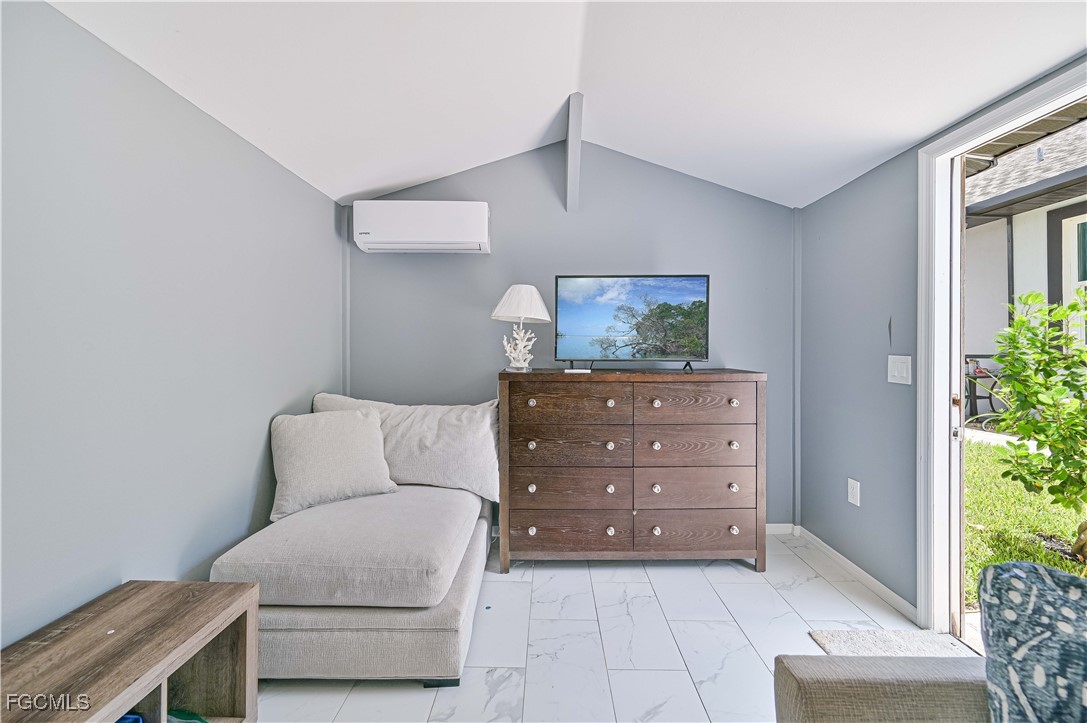 2273 Crystal Drive Fort Myers, FL 33907 - Photo 43 of 46 a bedroom with a bed and a window