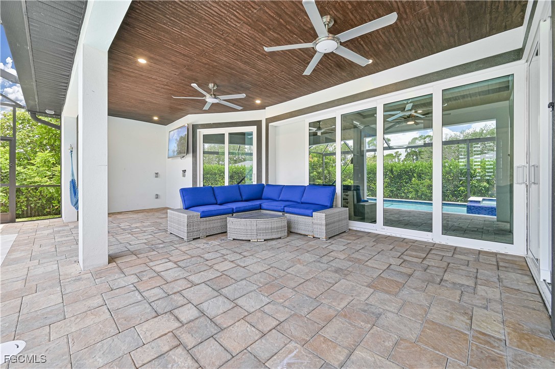 2273 Crystal Drive Fort Myers, FL 33907 - Photo 8 of 46 a backyard of a house with sofas fire pit and outdoor seating