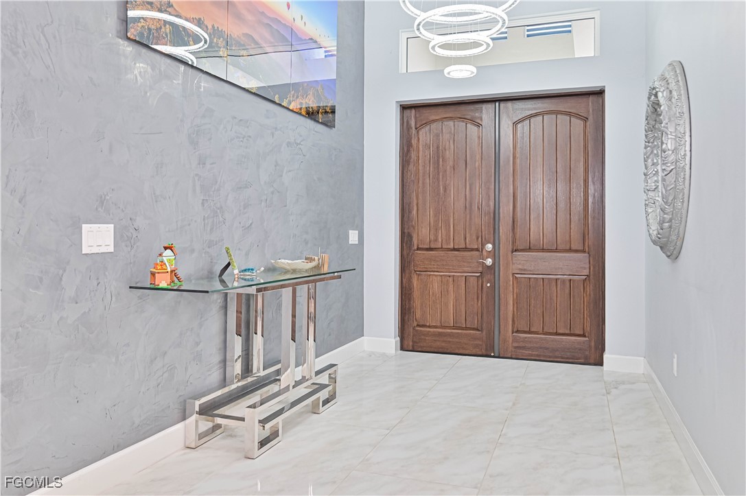 2273 Crystal Drive Fort Myers, FL 33907 - Photo 10 of 46 a view of an entryway with wooden floor
