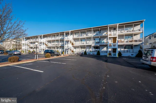 a city street lined with buildings and cars