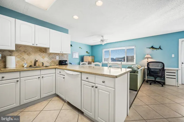a kitchen with sink cabinets and window