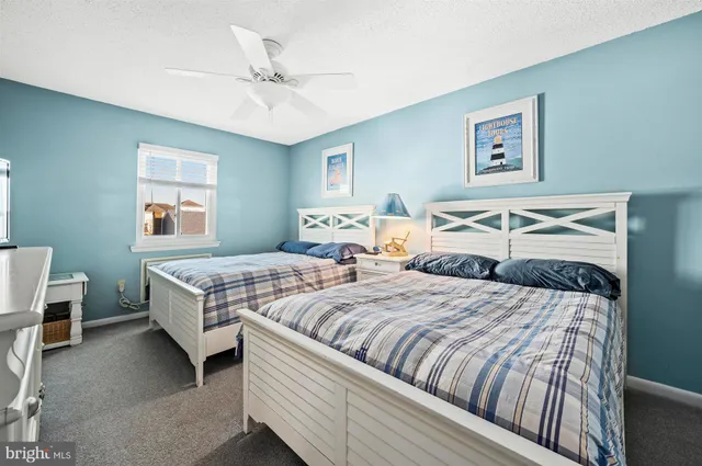 a bedroom with double bed and a window