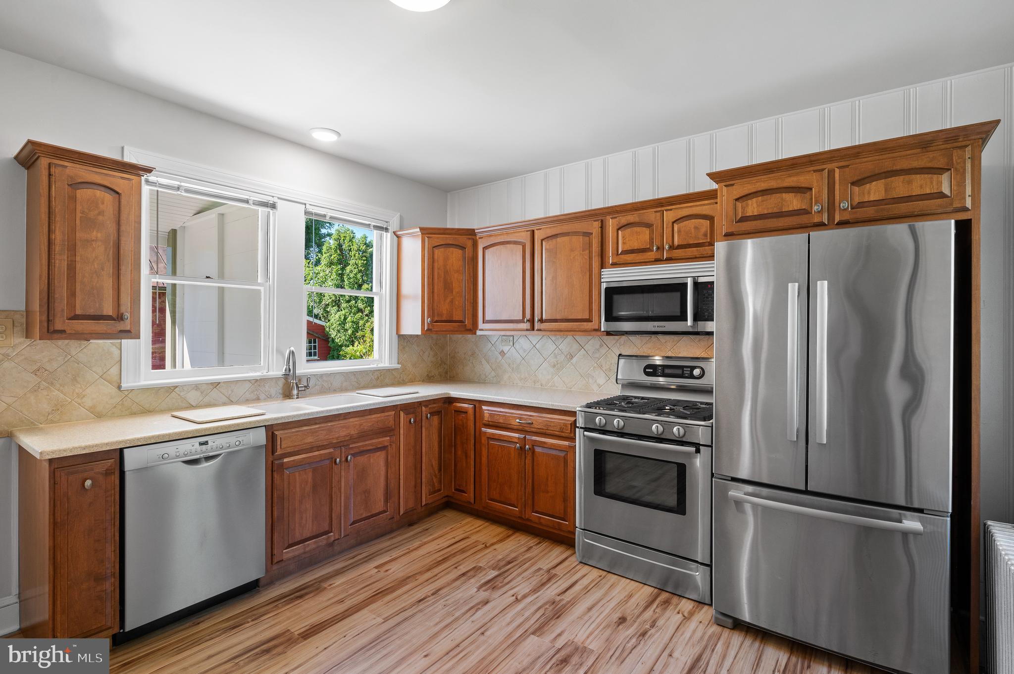804 North Whitford Road Exton, PA 19341 - Photo 12 of 46 a kitchen with stainless steel appliances a refrigerator sink and microwave