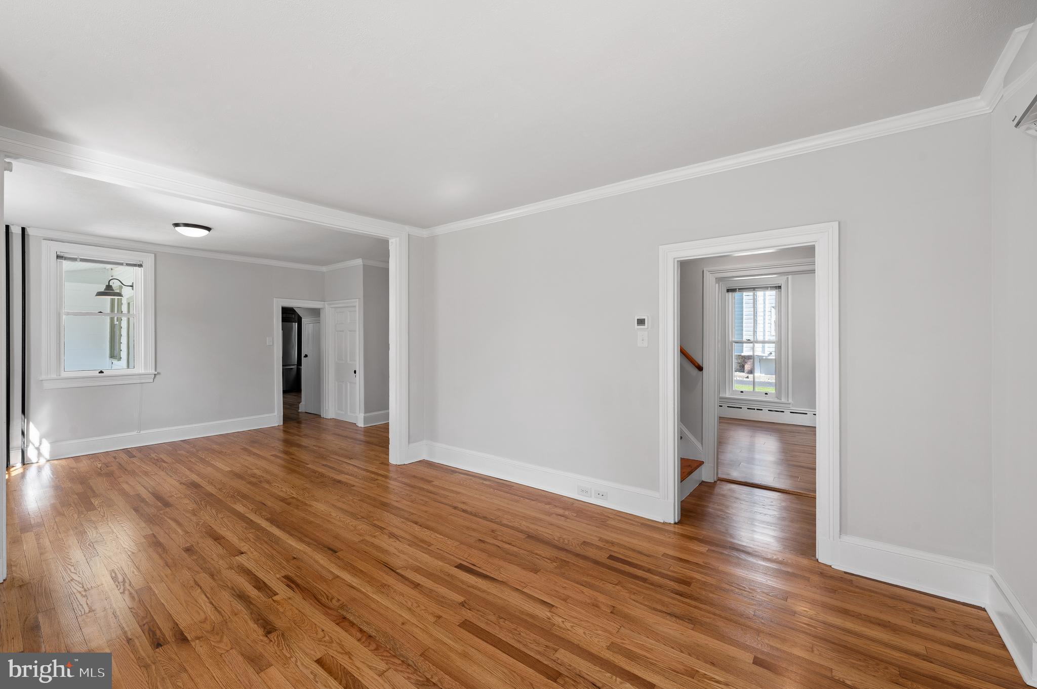 804 North Whitford Road Exton, PA 19341 - Photo 21 of 46 a view of empty room with wooden floor and kitchen