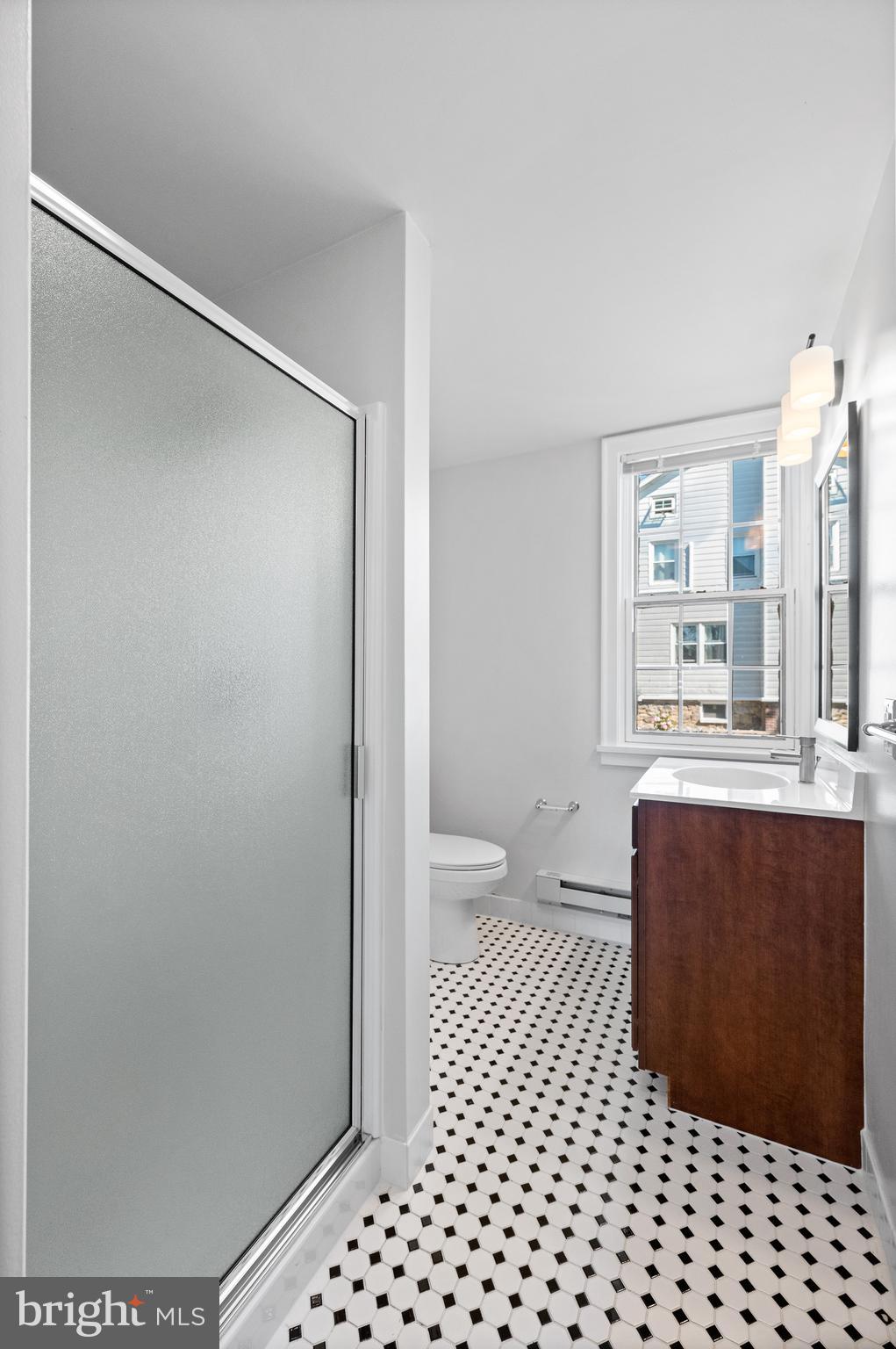 804 North Whitford Road Exton, PA 19341 - Photo 24 of 46 a bathroom with a sink a toilet a shower and a window