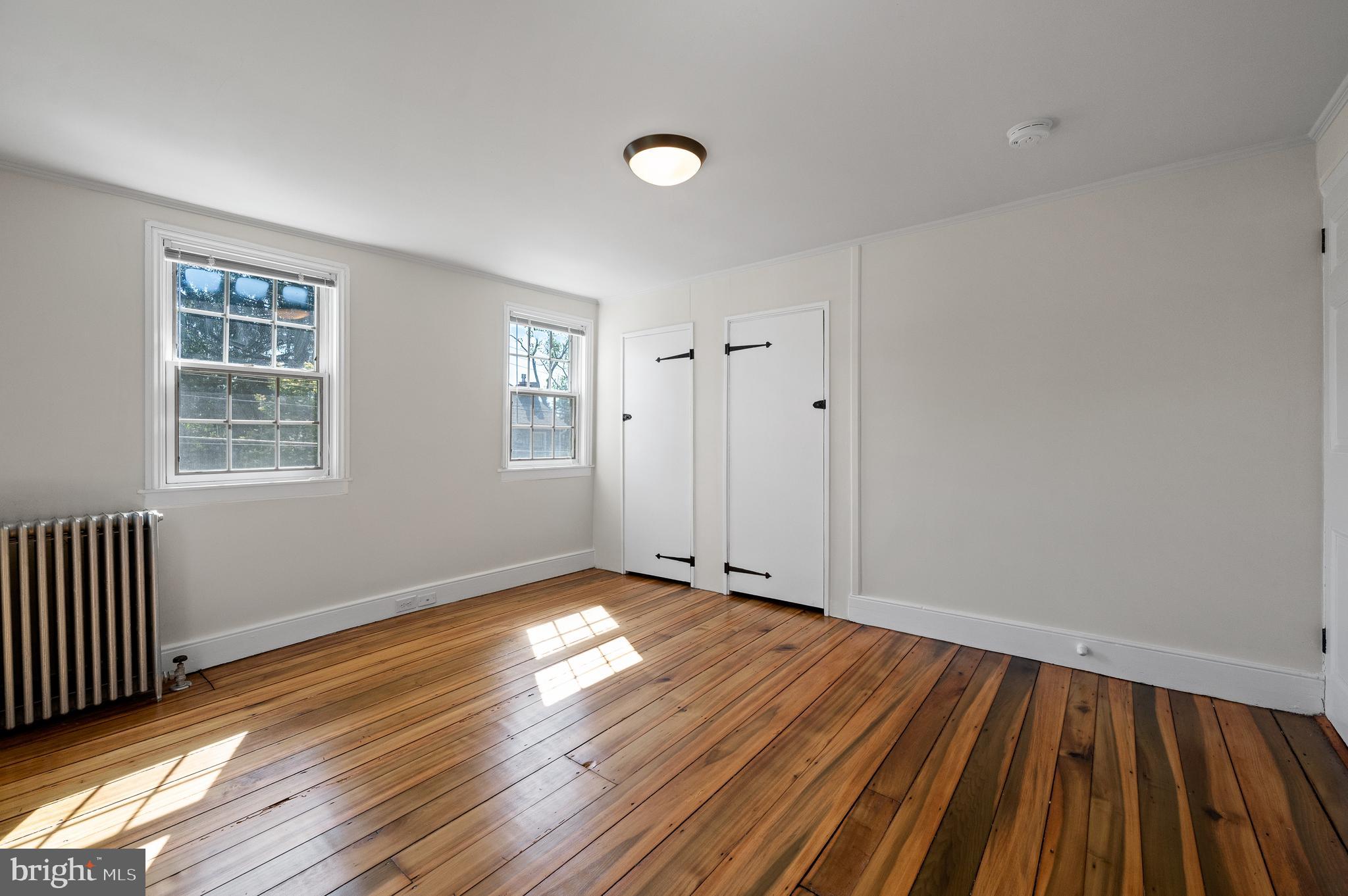 804 North Whitford Road Exton, PA 19341 - Photo 33 of 46 a view of an empty room with wooden floor and a window