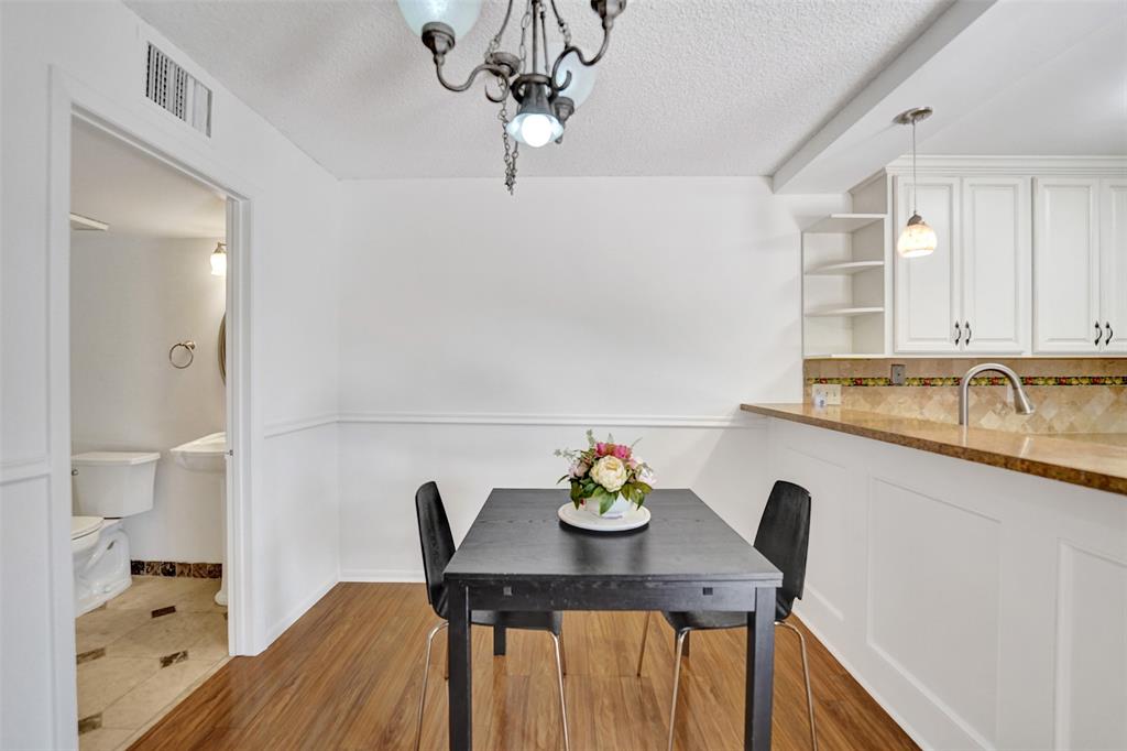 11884 Southwest 12th Place, Unit 11884 Davie, FL 33325 - Photo 13 of 48 a view of a kitchen area with furniture and wooden floor