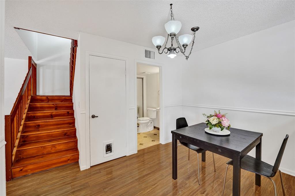 11884 Southwest 12th Place, Unit 11884 Davie, FL 33325 - Photo 14 of 48 a view of a dining room with furniture and wooden floor