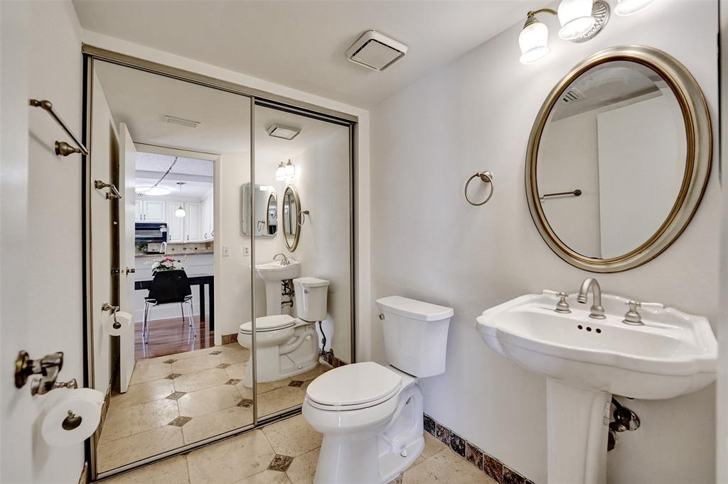 11884 Southwest 12th Place, Unit 11884 Davie, FL 33325 - Photo 15 of 48 a bathroom with a sink a toilet and a mirror