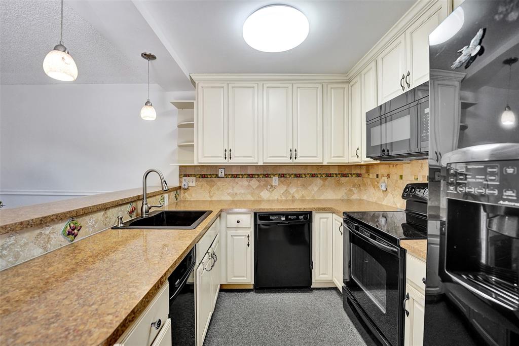 11884 Southwest 12th Place, Unit 11884 Davie, FL 33325 - Photo 19 of 48 a kitchen with a sink stove and microwave