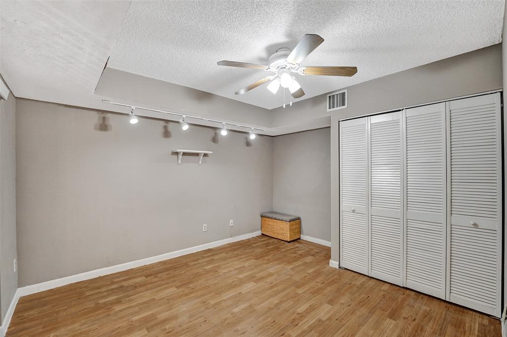 11884 Southwest 12th Place, Unit 11884 Davie, FL 33325 - Photo 22 of 48 a view of a room with wooden floor and white walls