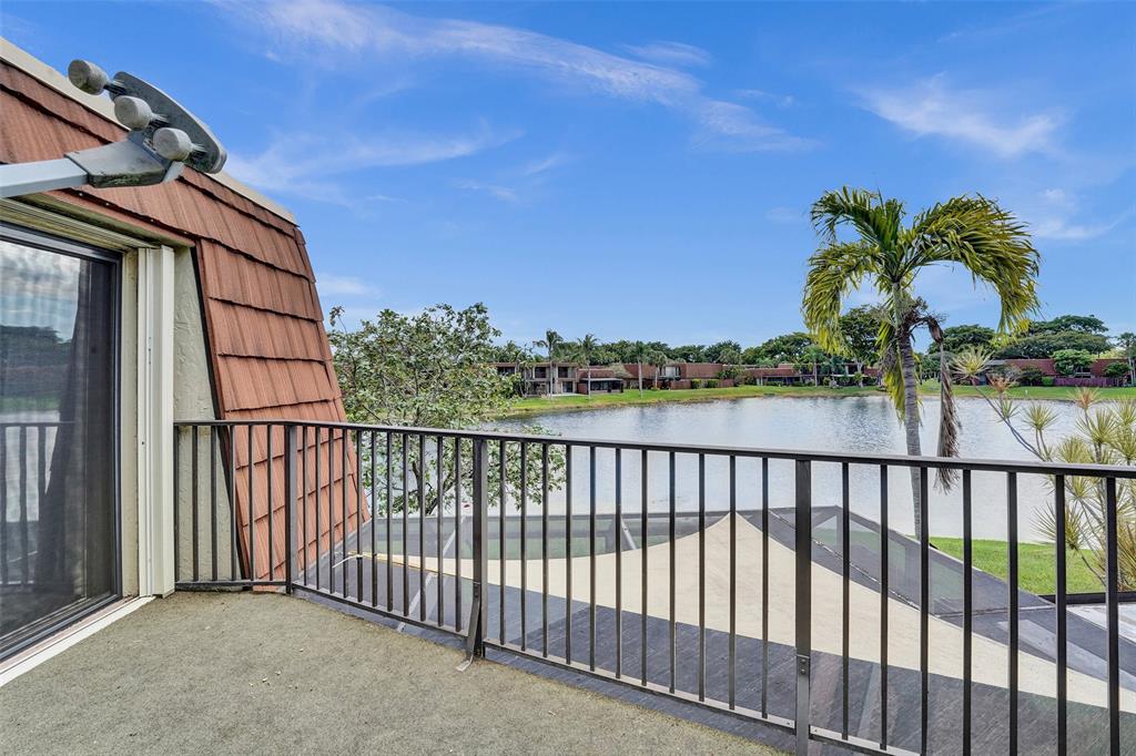11884 Southwest 12th Place, Unit 11884 Davie, FL 33325 - Photo 30 of 48 a view of a balcony with an outdoor space