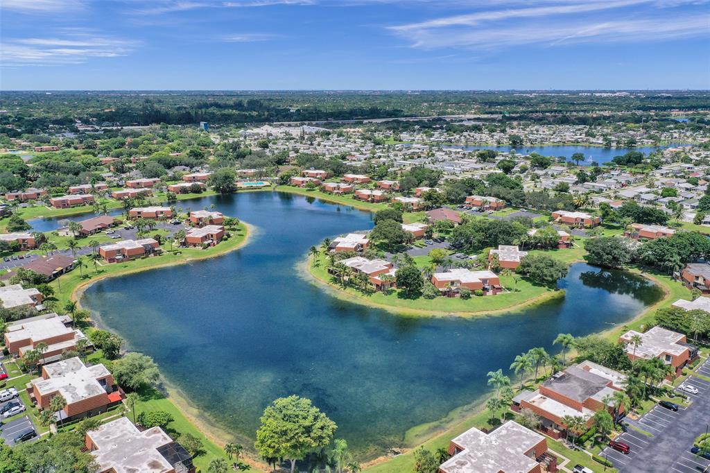 11884 Southwest 12th Place, Unit 11884 Davie, FL 33325 - Photo 3 of 48 a view of a lake with a mountain view
