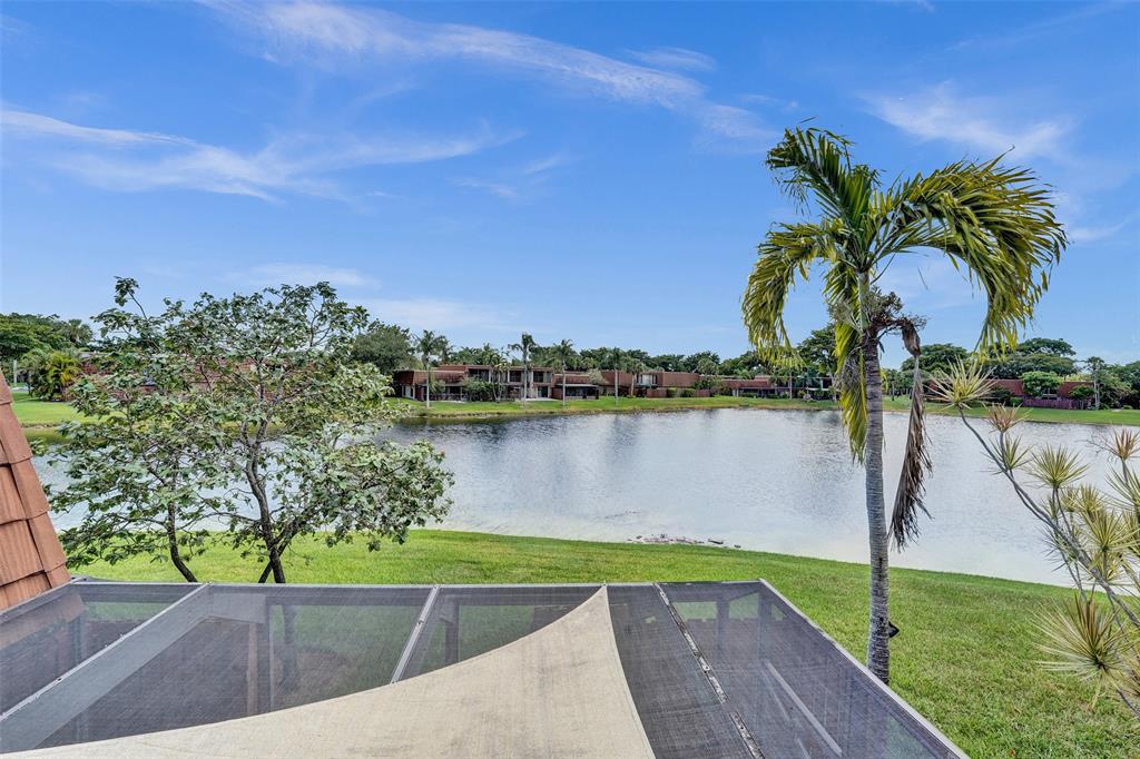 11884 Southwest 12th Place, Unit 11884 Davie, FL 33325 - Photo 37 of 48 a view of swimming pool with a lake view