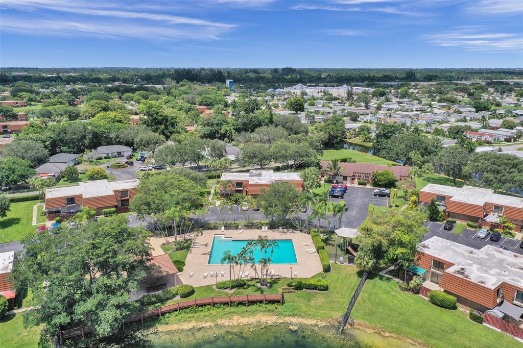11884 Southwest 12th Place, Unit 11884 Davie, FL 33325 - Photo 38 of 48 an aerial view of residential houses with outdoor space and trees