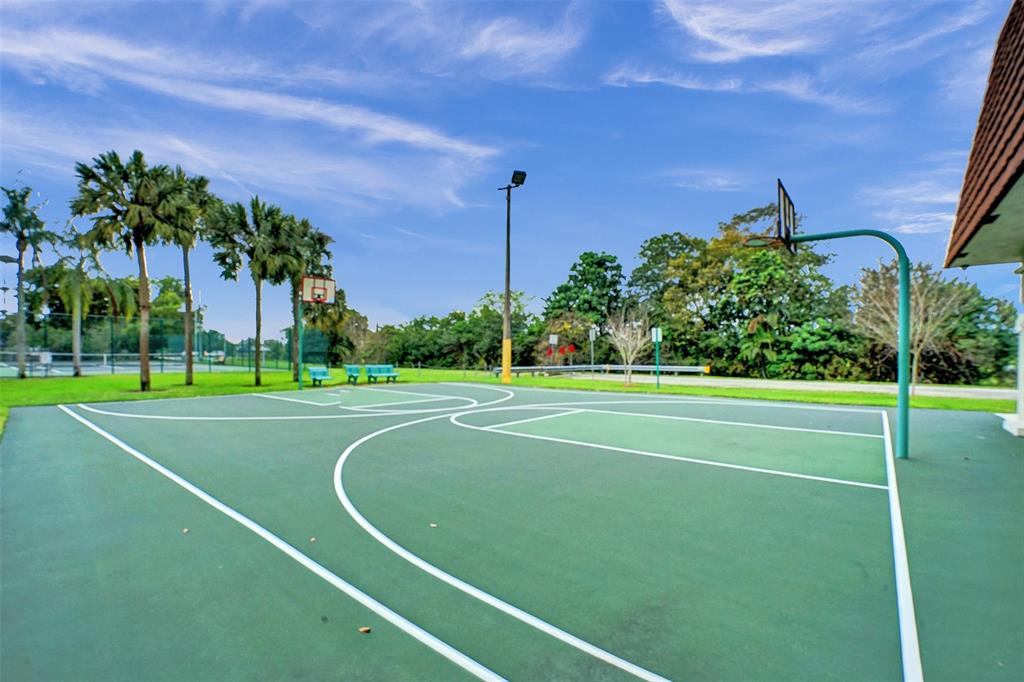 11884 Southwest 12th Place, Unit 11884 Davie, FL 33325 - Photo 44 of 48 a view of a tennis court