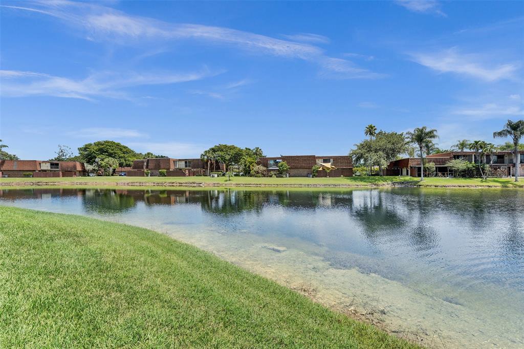 11884 Southwest 12th Place, Unit 11884 Davie, FL 33325 - Photo 5 of 48 a view of a lake with houses