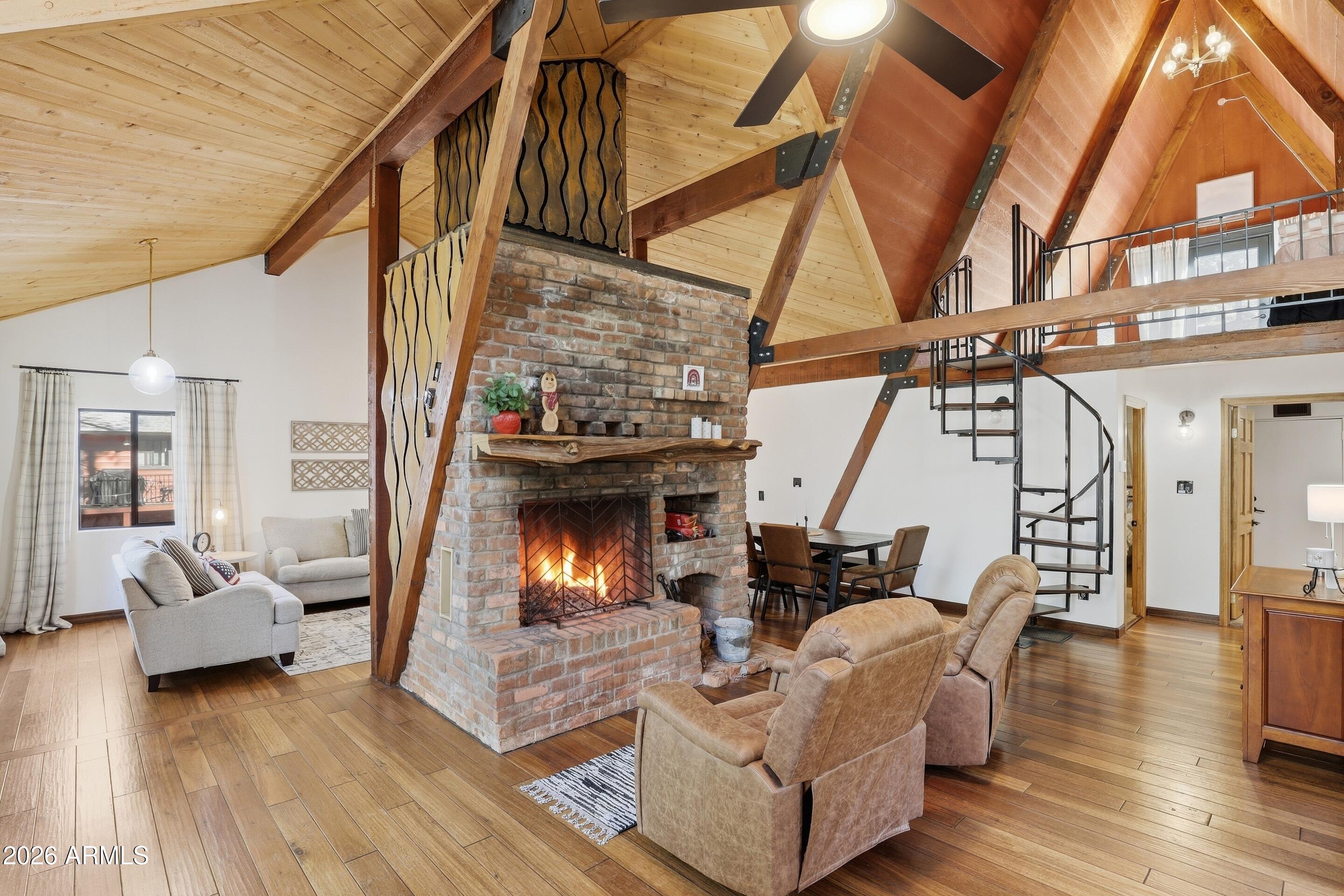 5101 Marys Way Pine, AZ 85544 - Photo 11 of 37 a living room with furniture and a fireplace