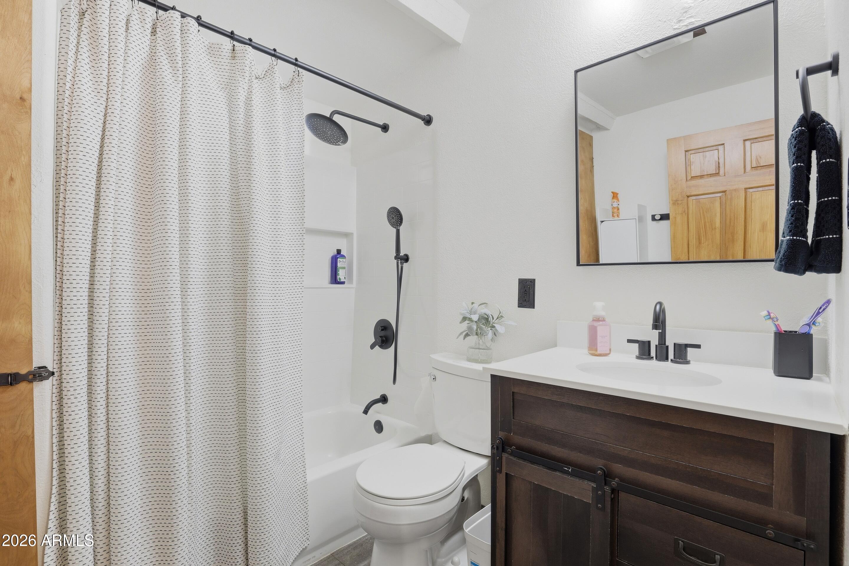 5101 Marys Way Pine, AZ 85544 - Photo 22 of 37 a bathroom with a granite countertop sink toilet a mirror and shower curtain