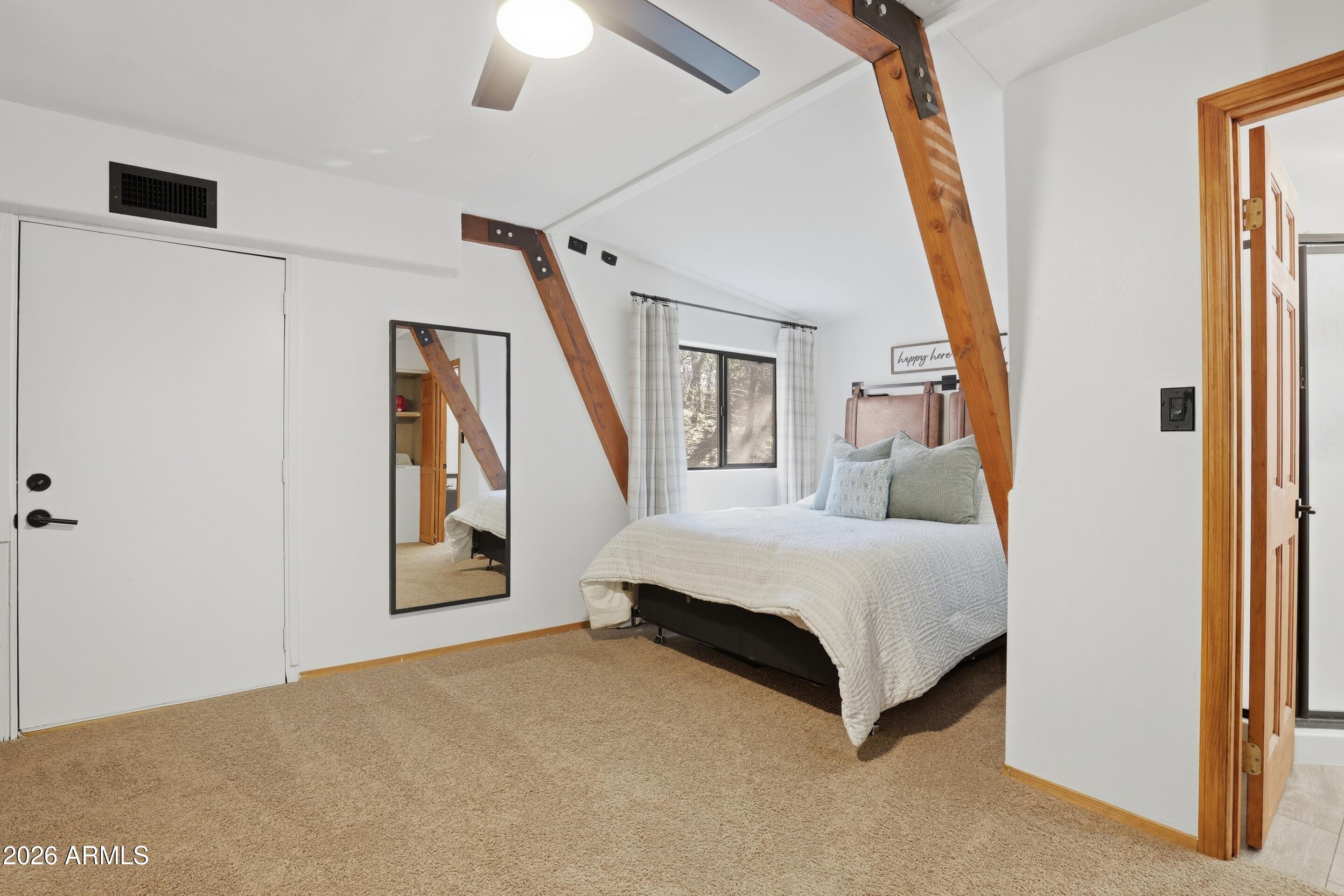 5101 Marys Way Pine, AZ 85544 - Photo 24 of 37 a spacious bedroom with a bed and a window