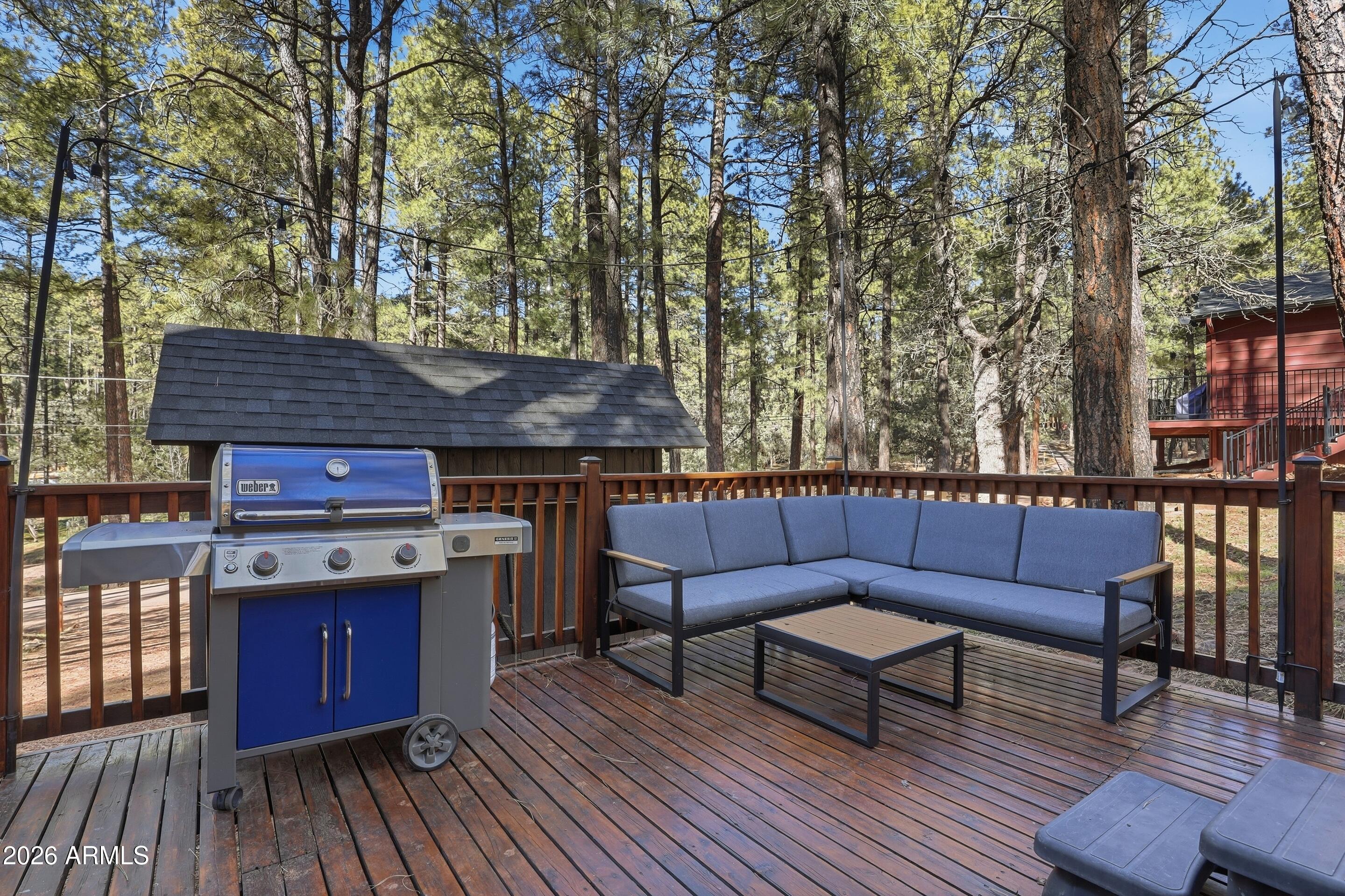 5101 Marys Way Pine, AZ 85544 - Photo 8 of 37 a view of sitting area on roof deck with wooden floor and fence