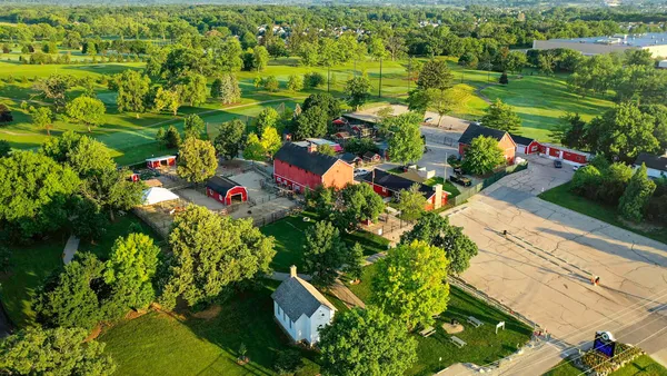 an aerial view of residential houses with outdoor space