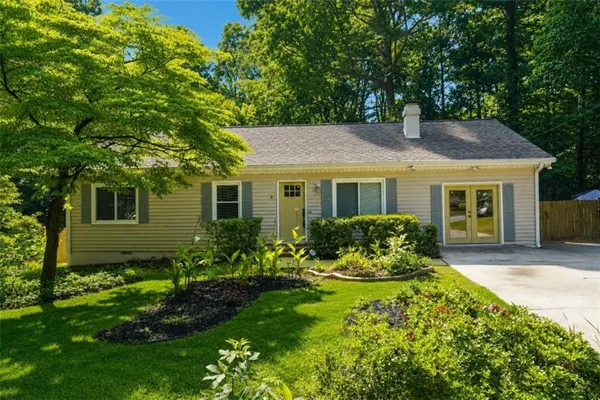 a front view of a house with a yard and porch